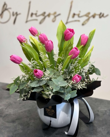 Luxury tulips in a white ceramic pot