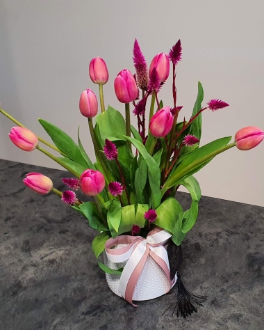 Pink tulips in a white ceramic pot