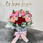 Romantic flower arrangement with mix colours roses