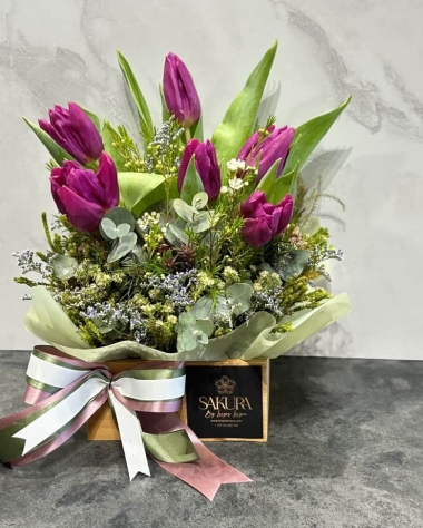 Tulips in a wooden bamboo box