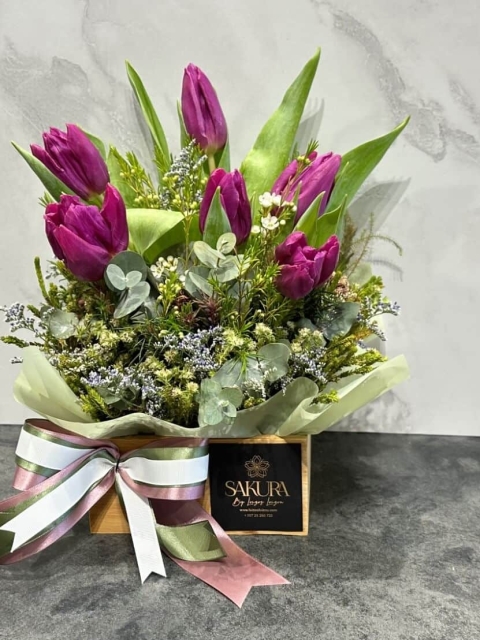 Tulips in a wooden bamboo box