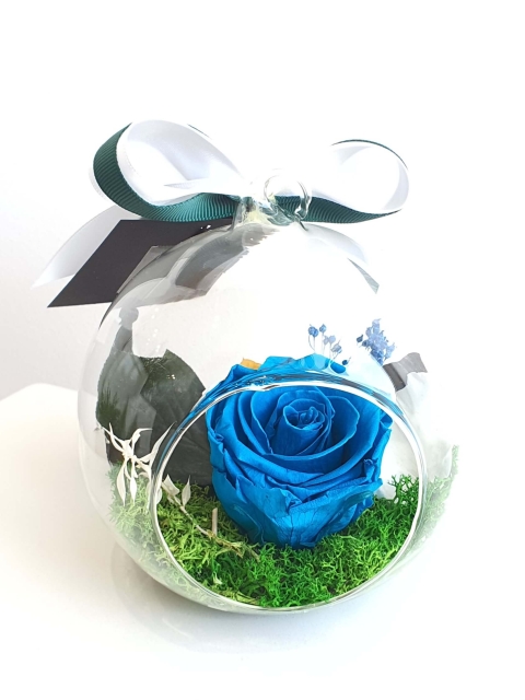 Blue preserved rose in a glass dome